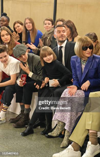 Cruz Beckham, Hana Cross, Romeo Beckham, Harper Beckham, David Beckham and Dame Anna Wintour attend the Victoria Beckham show during London Fashion...