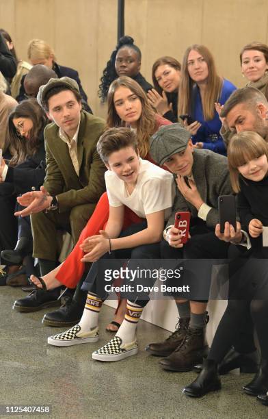 Brooklyn Beckham, Cruz Beckham, Hana Cross, Romeo Beckham, David Beckham and Harper Beckham attend the Victoria Beckham show during London Fashion...