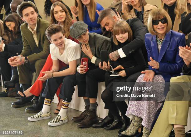 Brooklyn Beckham, Cruz Beckham, Hana Cross, Romeo Beckham, David Beckham, Harper Beckham and Dame Anna Wintour attend the Victoria Beckham show...