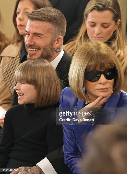 Harper Beckham, David Beckham and Dame Anna Wintour attend the Victoria Beckham show during London Fashion Week February 2019 at Tate Britain on...