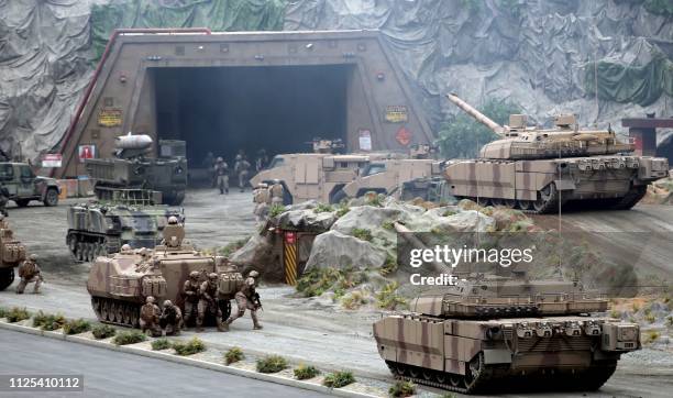 Members fo the UAE Armed forces perform a military drill during the opening of the International Defence Exhibtion and Confrence at the Abu Dhabi...