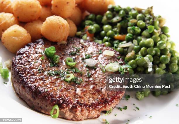 Steak hache with Pommes noisettes and Petits pois-carottes at La Cantoche restaurant, 227 Hollywood Road, Sheung Wan. 02NOV12