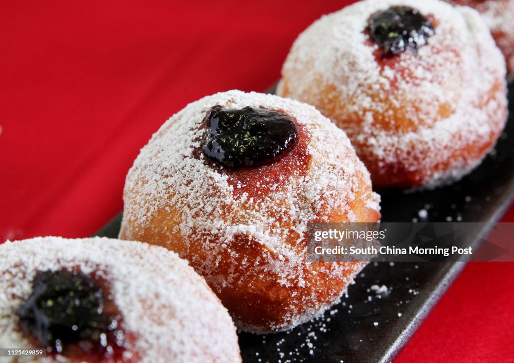 Sufganiyot (Jewish donuts for Hanukah) filled with blackberry jam made by chef Michael Erlik. 06NOV12