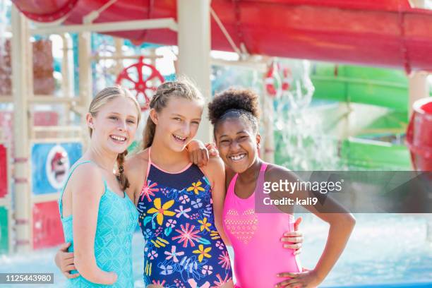 three teenage girls at water park - amputee girl stock pictures, royalty-free photos & images