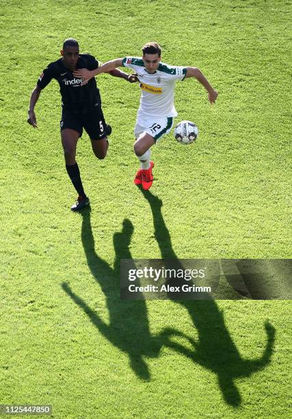 Florian Neuhaus of Borussia Moenchengladbach is challenged by Gelson Fernandes of Eintracht Frankfurt during the Bundesliga match between Eintracht...