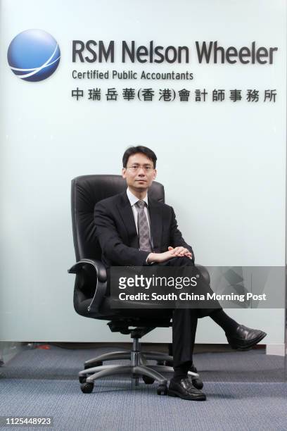 Chris Wong, Partner, RSM Nelson Wheeler, poses for pictures at thier office in Causeway Bay. 03DEC12