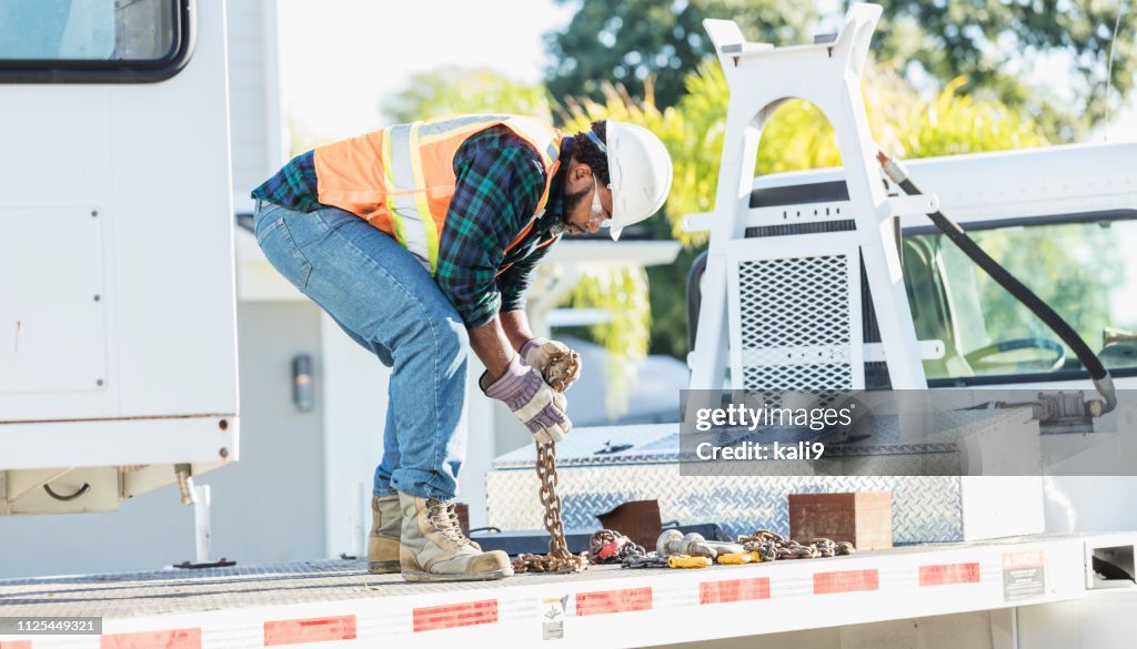 African-American construction worker on a crane