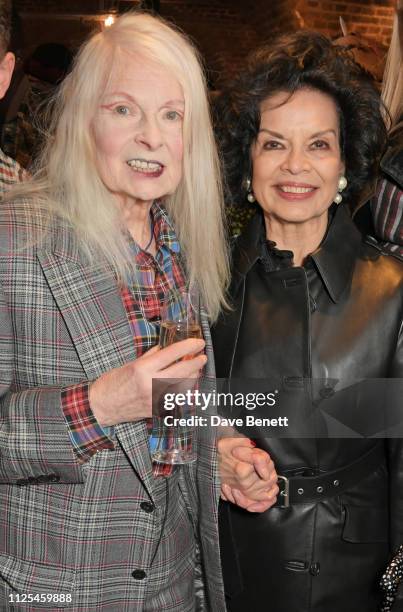 Dame Vivienne Westwood and Bianca Jagger pose backstage at the Vivienne Westwood show during London Fashion Week February 2019 on February 17, 2019...