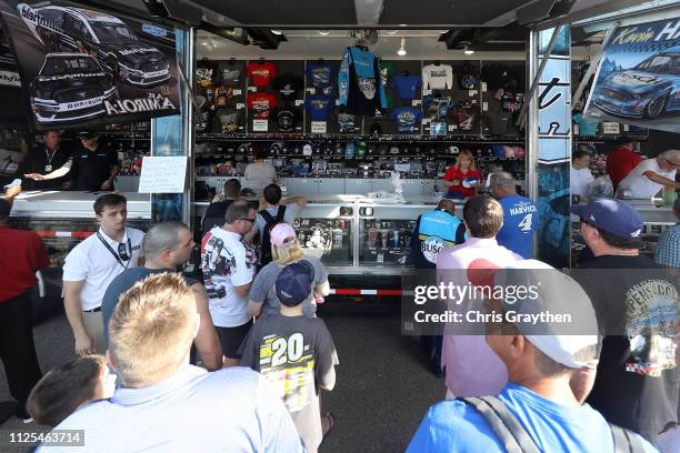 Fans line up to buy merchandise from Kevin Harvick, driver of the Busch Beer Car2Can Ford, during the Monster Energy NASCAR Cup Series 61st Annual...