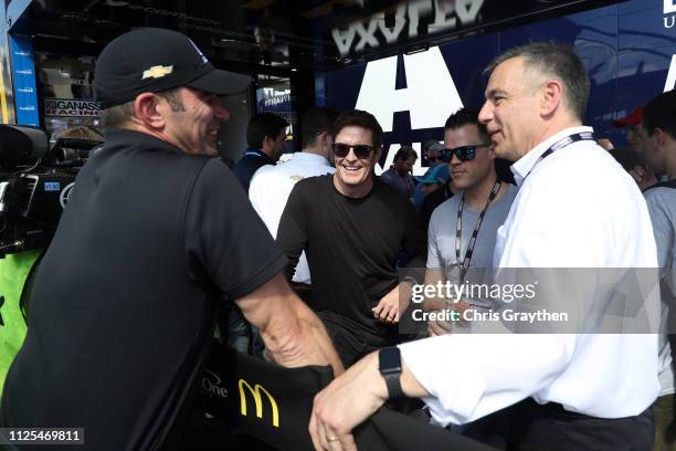 Max Papis talks with IndyCar driver Scott Dixon during the Monster Energy NASCAR Cup Series 61st Annual Daytona 500 at Daytona International Speedway...