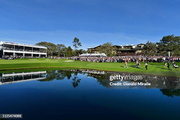 The group of Jon Rahm of Spain, Justin Rose of England and Adam Scott of Australia walk up the 18th fairway on the South Course during the final...