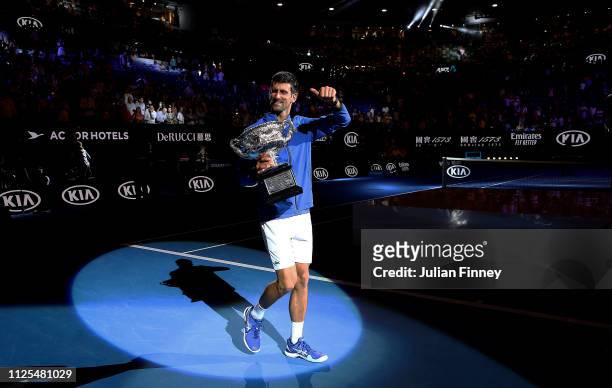 Novak Djokovic of Serbia with the Norman Brookes Challenge Cup following victory in his Men's Singles Final match against Rafael Nadal of Spain...