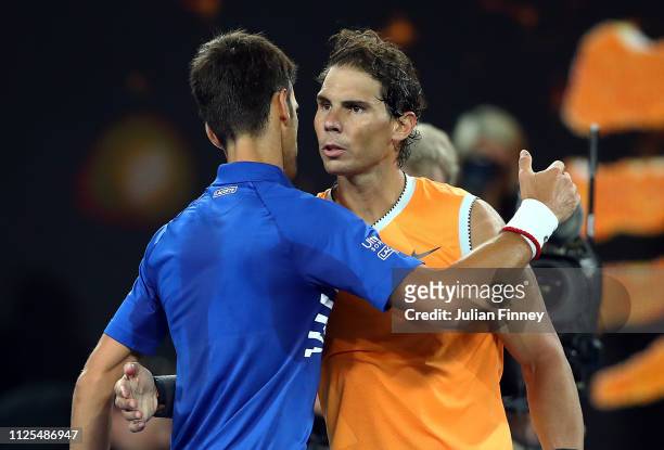 Novak Djokovic of Serbia is congratulated in his Men's Singles Final match by Rafael Nadal of Spain during day 14 of the 2019 Australian Open at...