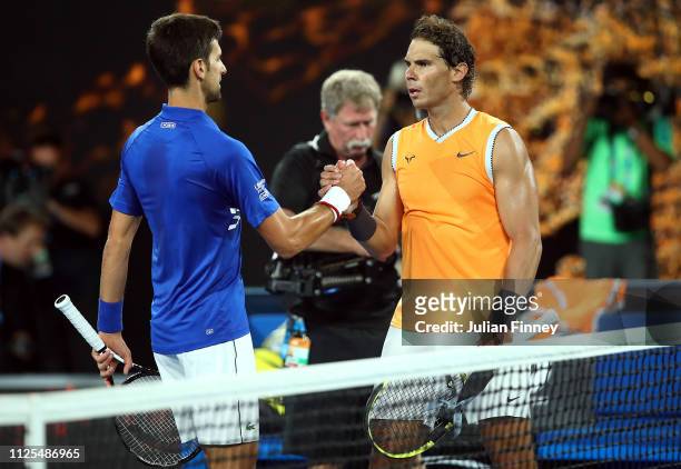 Novak Djokovic of Serbia is congratulated in his Men's Singles Final match by Rafael Nadal of Spain during day 14 of the 2019 Australian Open at...