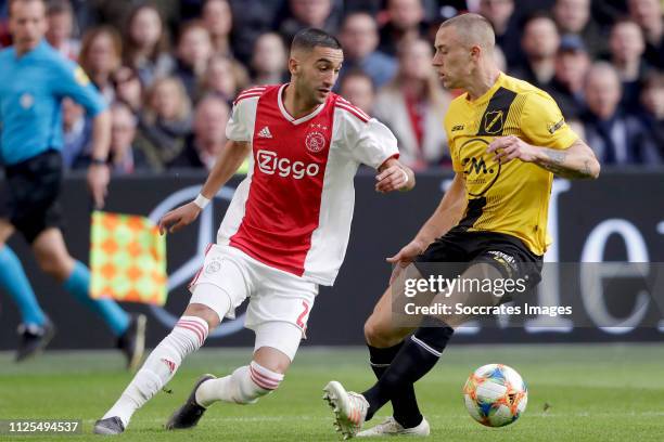 Hakim Ziyech of Ajax, Alex Gersbach of NAC Breda during the Dutch Eredivisie match between Ajax v NAC Breda at the Johan Cruijff Arena on February...