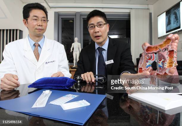 Liu Yulong, Oncologist in Chinese Medicine and Chan Leung-cho, specialist in clinical oncology, pose for pictures at HKACS Dr & Mrs Michael SK Mak...