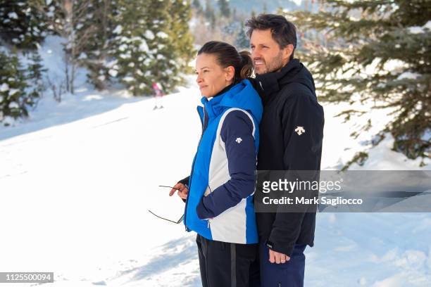 Hilary Swank and Philip Schneider, wearing Descente Ski Apparel, pose for photos at the St. Regis Hotel on January 27, 2019 in Park City, Utah.