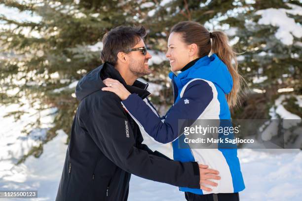 Hilary Swank and Philip Schneider, wearing Descente Ski Apparel, pose for photos at the St. Regis Hotel on January 27, 2019 in Park City, Utah.