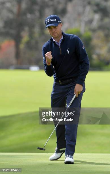 Justin Thomas pumps fist after saving par on the seventh hole during the final round of the Genesis Open at Riviera Country Club on February 17, 2019...