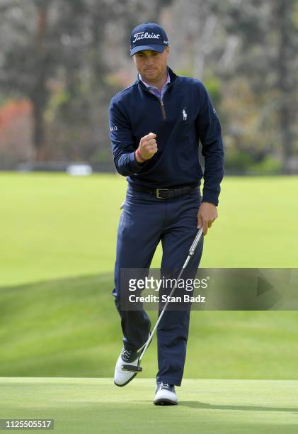 Justin Thomas pumps fist after saving par on the seventh hole during the final round of the Genesis Open at Riviera Country Club on February 17, 2019...
