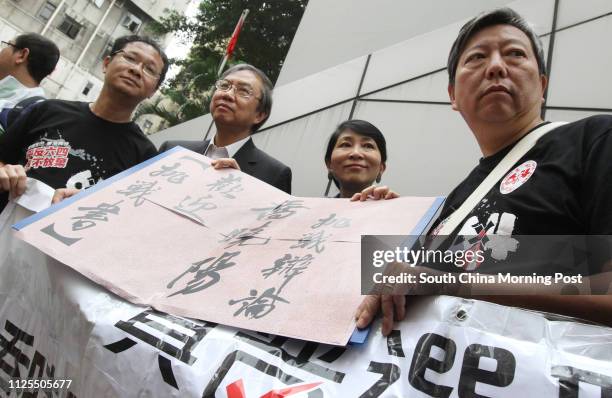 Richard Tsoi Yiu-cheong, Cheng Yu-shek, Claudia Mo Man-ching and Lee Cheuk-yan of Alliance for True Democracy gather in front of police station in...