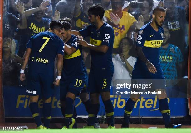 Mauro Zarate of Boca Juniors celebrates with teammates after scoring the second goal of his team during a match between Boca Juniors and Lanus as...