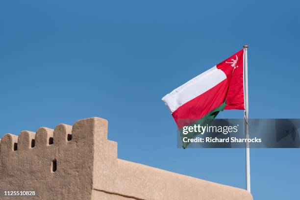 omani flag - omani flag stock pictures, royalty-free photos & images