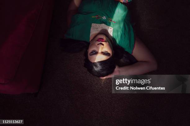 portrait of young woman with light across face - transgender foto e immagini stock