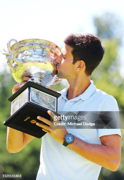 Novak Djokovic of Serbia poses with the Norman Brookes Challenge Cup after winning the 2019 Australian Open at Picnic Point, Royal Botanical Gardens...