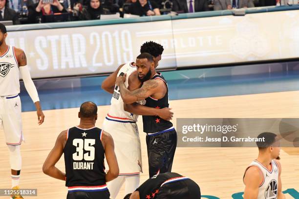 Joel Embiid of Team Giannis and LeBron James of Team LeBron hug prior to the 2019 NBA All Star Game on February 17, 2019 at Spectrum Center in...