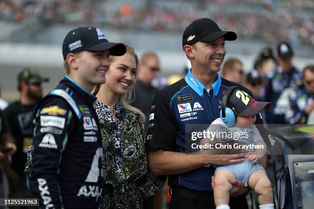 Crew Chief of William Byron, driver of the Axalta Chevrolet, Chad Knaus holds his child during the Monster Energy NASCAR Cup Series 61st Annual...