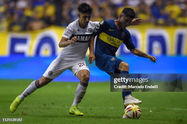 Jorman Campuzano of Boca Juniors fights for the ball with Nicolas Di Placido of Lanus during a match between Boca Juniors and Lanus as part of...