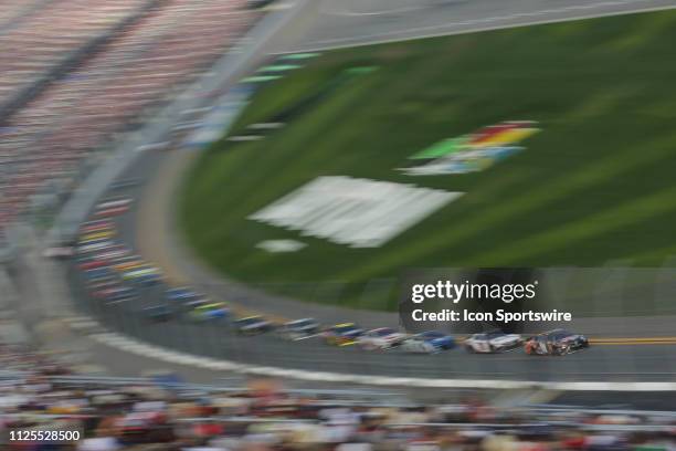 Kyle Busch, driver of the Joe Gibbs Racing M&M's Chocolate Bar Toyota Camry, leads during the Daytona 500 on February 17, 2019 at Daytona...