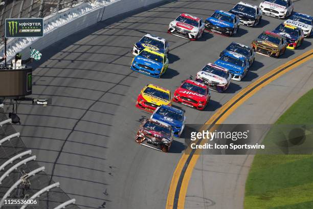 Kyle Busch, driver of the Joe Gibbs Racing M&M's Chocolate Bar Toyota Camry, wins the first stage of the season during the Daytona 500 on February...