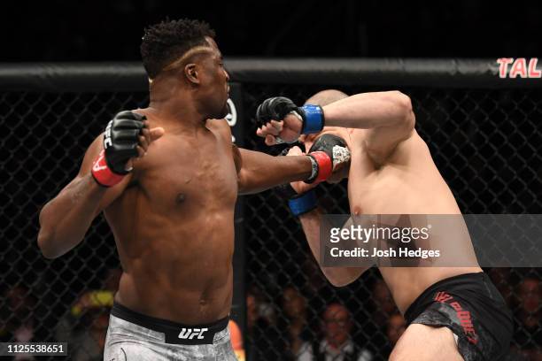 Francis Ngannou of Cameroon punches Cain Velasquez in their heavyweight bout during the UFC Fight Night event at Talking Stick Resort Arena on...