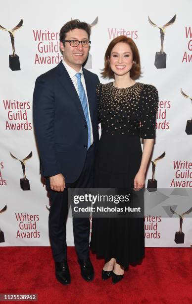 Michael Koman and Ellie Kemper pose backstage during the 71st Annual Writers Guild Awards New York ceremony at Edison Ballroom on February 17, 2019...