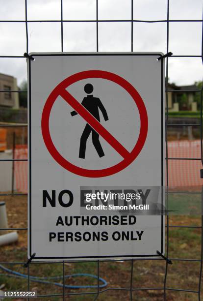 'no entry. authorised persons only' sign on the wire fence of a building site - keep out sign stock pictures, royalty-free photos & images