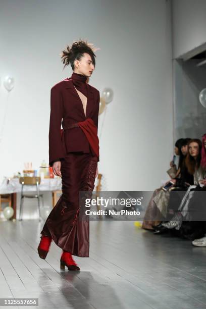 Model walks the runway at the Richard Malone show during London Fashion Week February 2019 at the RIBA on February 18, 2019 in London, England.