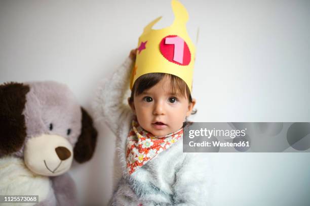 portrait of baby girl with paper crown on first birthday - one baby girl only stock pictures, royalty-free photos & images