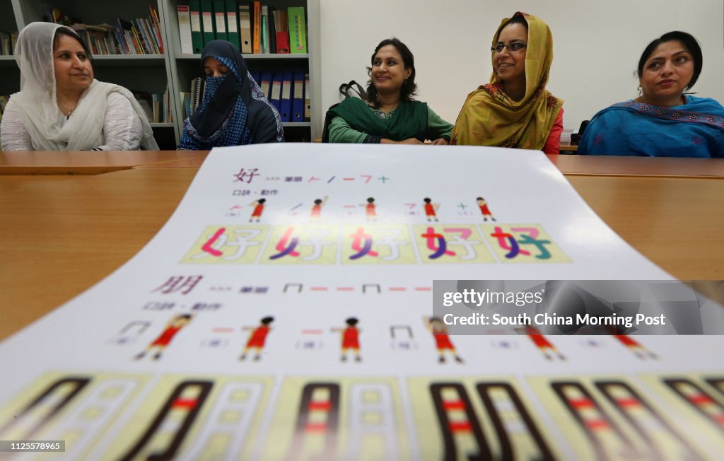 Ethnic minority candidates (left to right) Khadija Javed (Pakistan), Samreen (Pakistan), Sabina Sultana(Bangladesh), Ume Rabbab (Pakistan) and Shaheen Kiswar (Pakistan) receive their International General Certificate of Secondary Education (IGCSE) Chinese