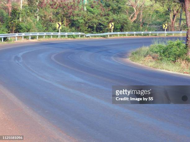 sharp curved road - nakhon ratchasima stock pictures, royalty-free photos & images