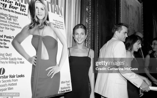 Jennifer Aniston poses with a blow-up of her cover of Cosmopolitan Magazine at a party in 1997 in New York City, New York.