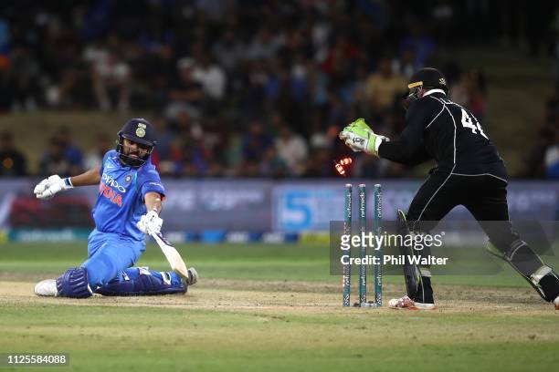 Rohit Sharma of India is stumped by Tom Latham of New Zealand during game three of the One Day International series between New Zealand and India at...