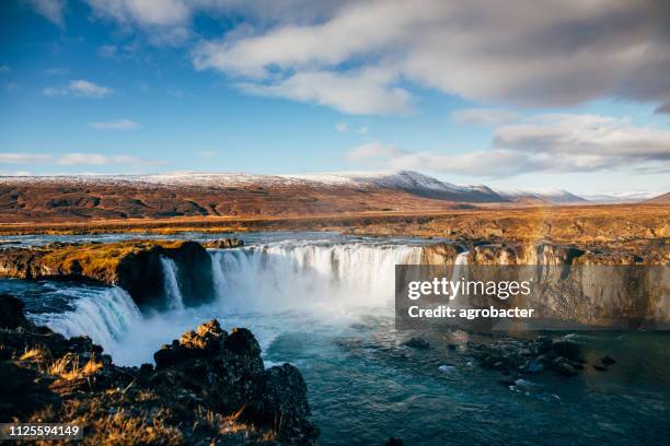 godafoss waterfall with rainbow - godafoss stock pictures, royalty-free photos & images