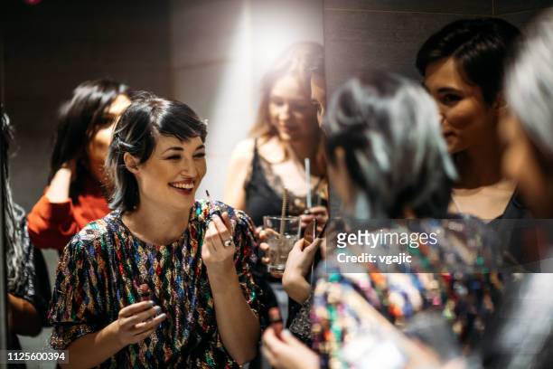 night club party - friends women makeup stockfoto's en -beelden