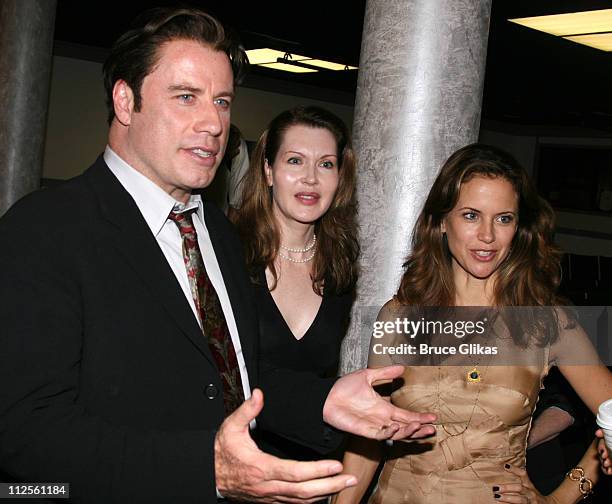 Actor John Travolta talks to the cast with playwright Myra Bairstow and Kelly Preston when he visits "The Rise of Dorothy Hale" Off-Broadway at St....