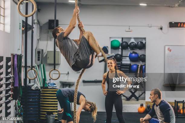 man working out with friends - circuit training stock pictures, royalty-free photos & images