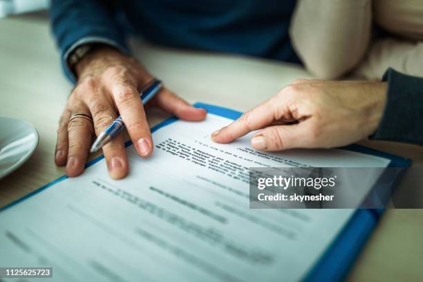 you should sign here! - loan agreement stock pictures, royalty-free photos & images