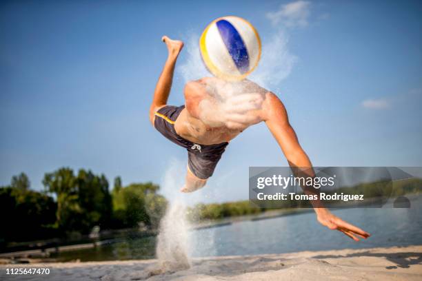 beach volleyball player digging the ball - thorax stock pictures, royalty-free photos & images