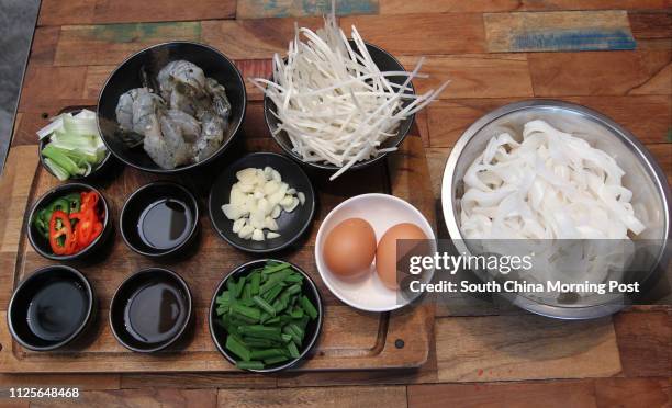 Jesse Teh, head chef of Secret Ingredients, demonstrates how to make prawn char kway teow. 19NOV13